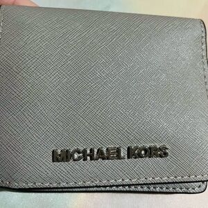 Michael Kors small grey folding wallet.